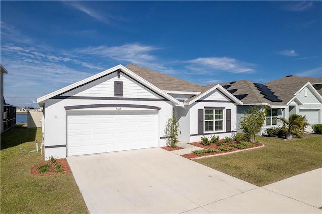 single story home featuring a garage, a front yard, and solar panels