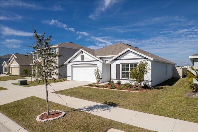 view of front of property featuring a garage and a front yard