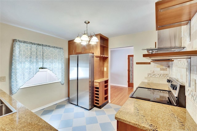 kitchen featuring sink, an inviting chandelier, tasteful backsplash, hanging light fixtures, and appliances with stainless steel finishes