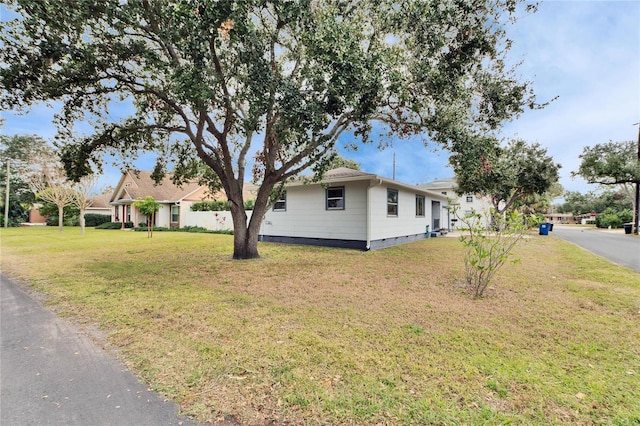 view of home's exterior featuring a lawn