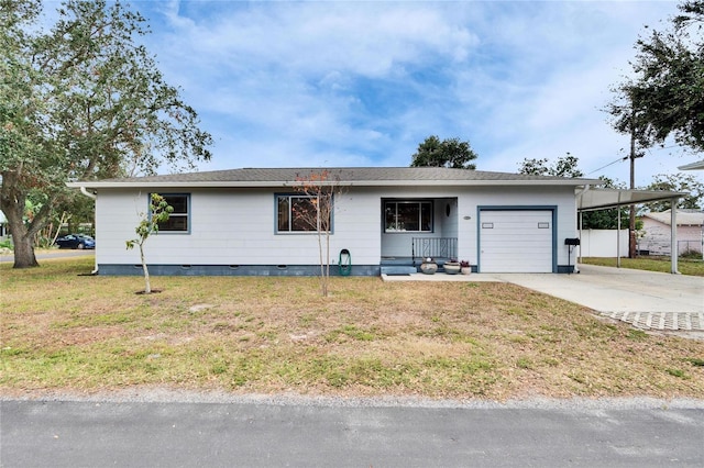 ranch-style home with a garage, a carport, and a front lawn