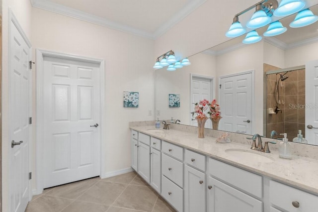 bathroom with crown molding, vanity, a shower with shower door, and tile patterned flooring