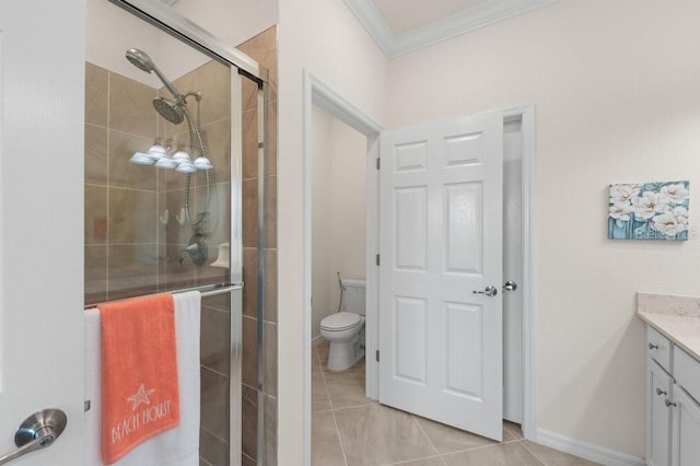 bathroom with toilet, a shower with shower door, crown molding, vanity, and tile patterned flooring