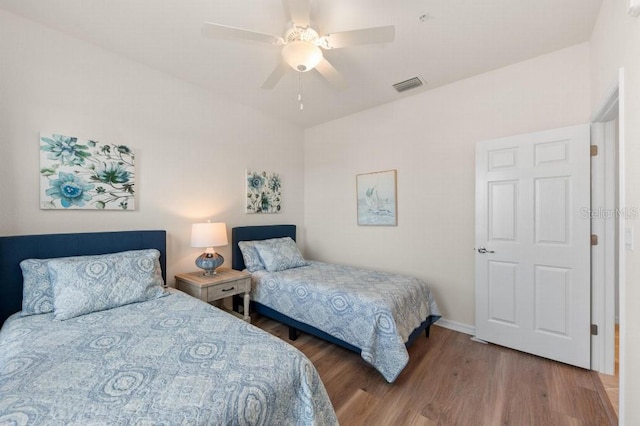 bedroom featuring hardwood / wood-style floors and ceiling fan