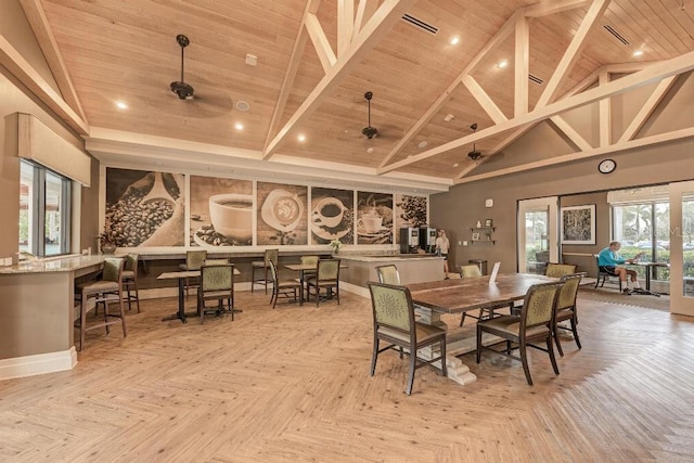 dining room with light parquet floors, a high ceiling, wood ceiling, and ceiling fan