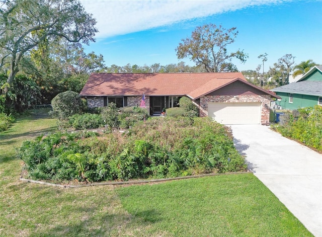 ranch-style house with a garage and a front yard