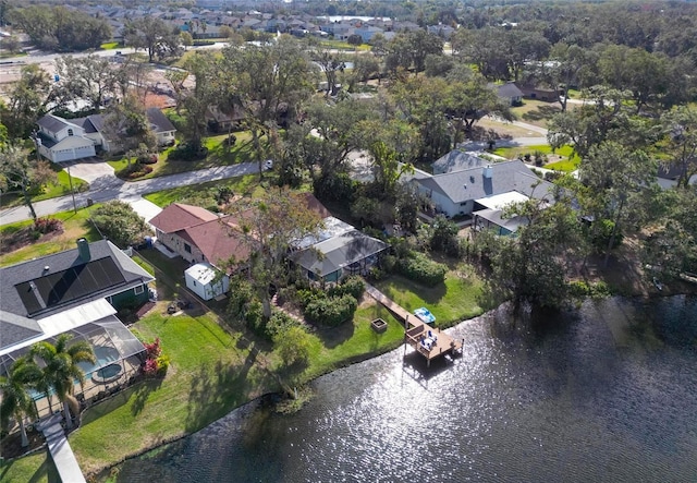 drone / aerial view with a residential view and a water view