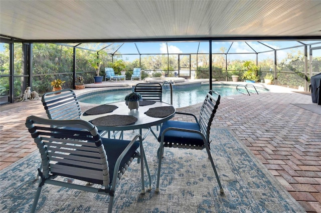 pool featuring a patio, outdoor dining area, and a lanai