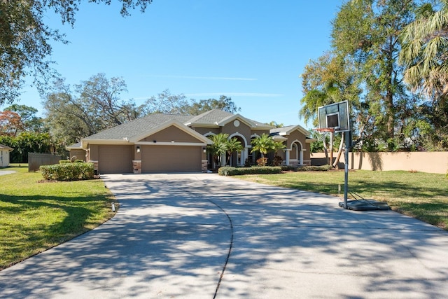 view of front facade with a garage and a front lawn