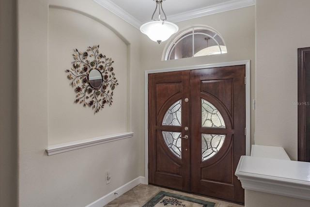 tiled entryway featuring french doors and ornamental molding