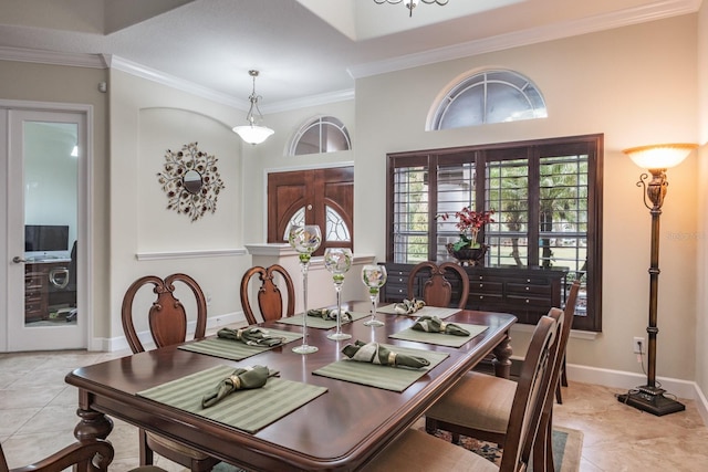 dining area with crown molding and light tile patterned floors