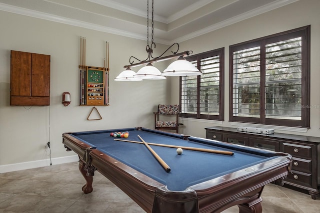 game room featuring a raised ceiling, crown molding, and light tile patterned floors