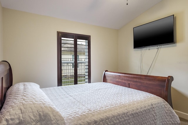 bedroom with lofted ceiling