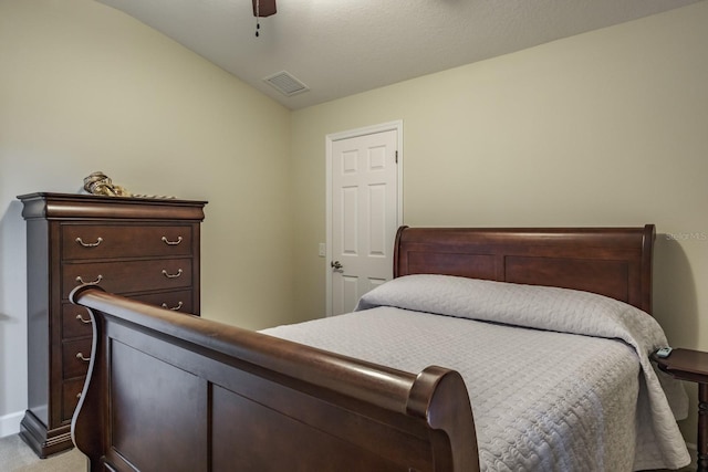 bedroom featuring lofted ceiling, light colored carpet, and ceiling fan