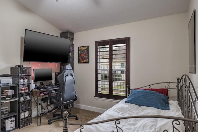 carpeted bedroom featuring multiple windows, vaulted ceiling, and a textured ceiling