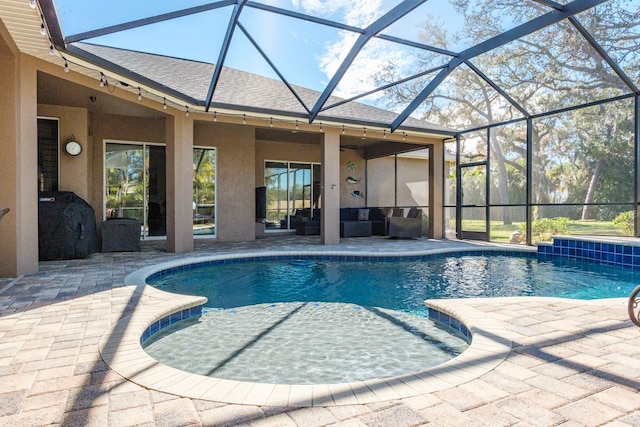 view of swimming pool with a patio area and glass enclosure