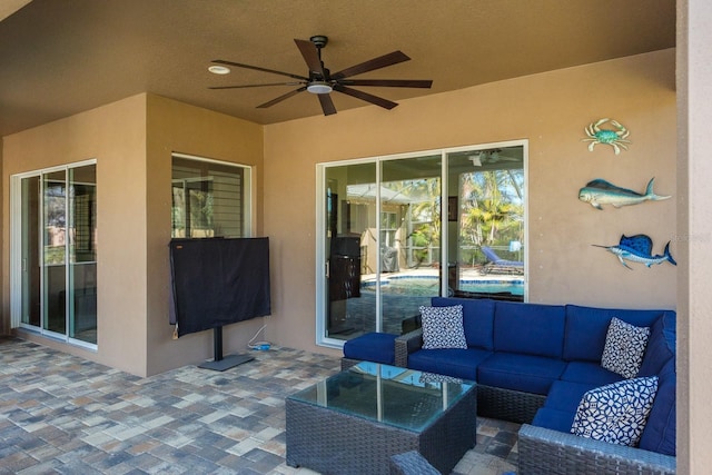 view of patio / terrace featuring ceiling fan and an outdoor living space