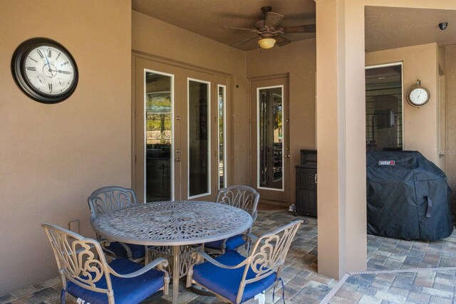 view of patio featuring area for grilling and ceiling fan