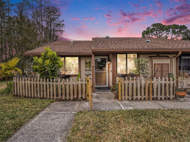 view of front of home with a lawn