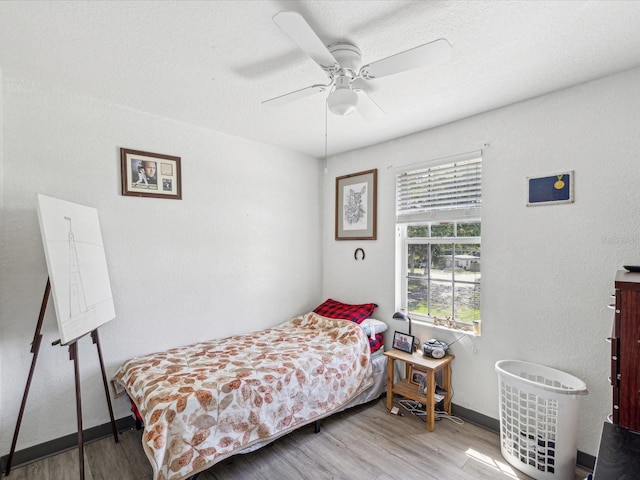 bedroom featuring ceiling fan and light wood-type flooring