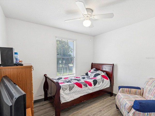 bedroom with ceiling fan and light wood-type flooring