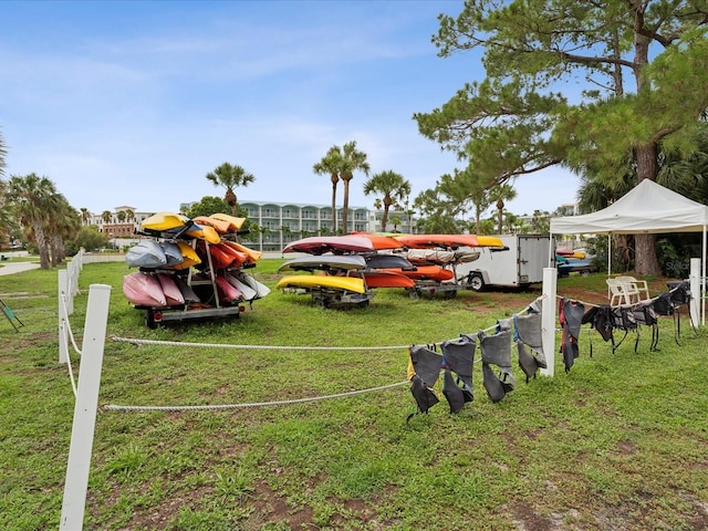 view of vehicle parking featuring a lawn