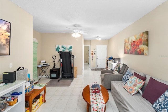 living room with a textured ceiling and ceiling fan