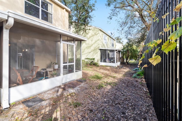 view of yard with a sunroom