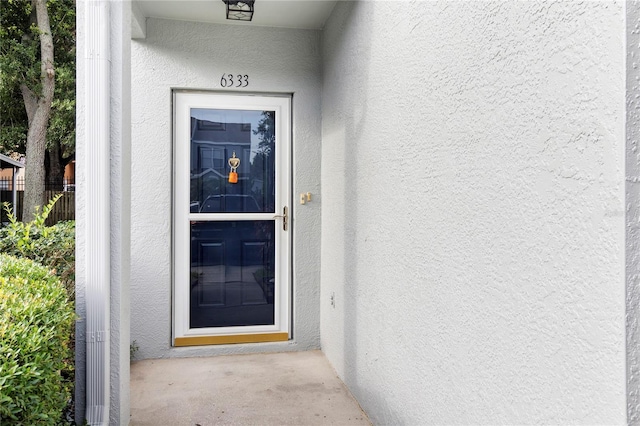 6333 Osprey Lake Cir, Riverview, FL 33578 - doorway to property with stucco siding