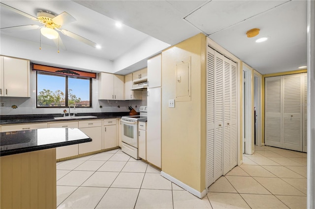 kitchen with sink, white electric range oven, backsplash, and light tile patterned floors