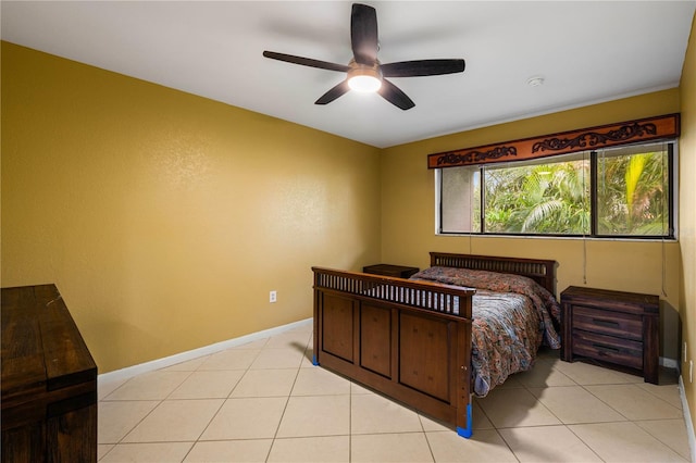 tiled bedroom featuring ceiling fan