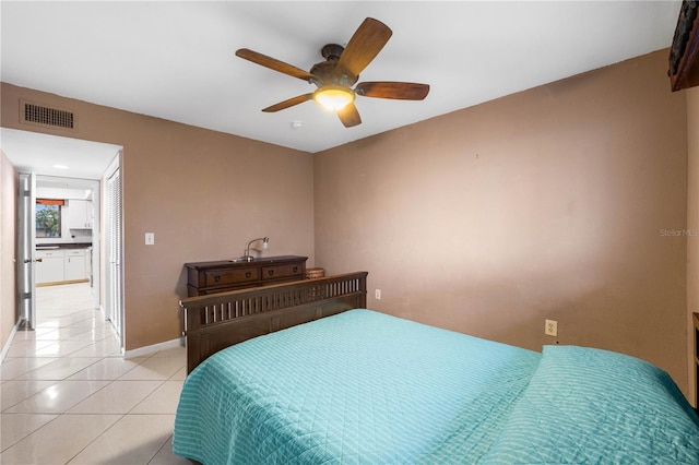 tiled bedroom with ceiling fan