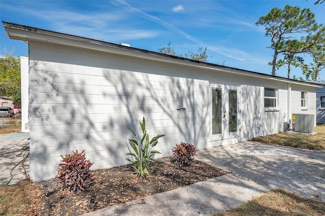 view of property exterior featuring a patio and central air condition unit