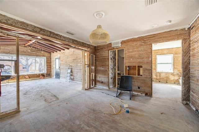 miscellaneous room featuring crown molding and vaulted ceiling with beams