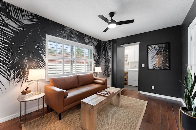 living room with washer / clothes dryer, dark wood-type flooring, and ceiling fan