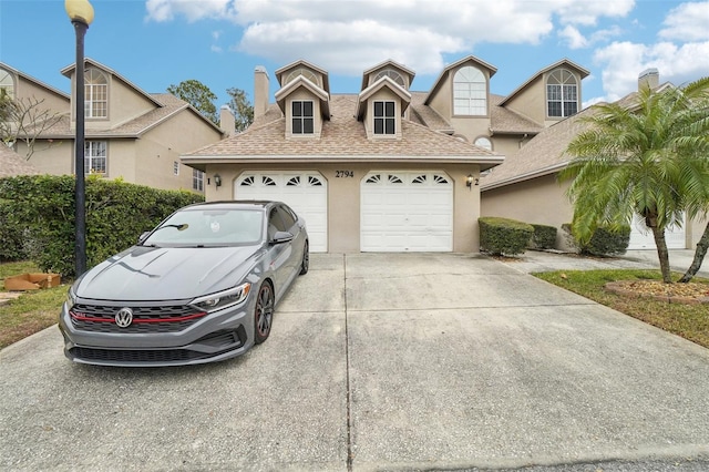 view of front of property with a garage