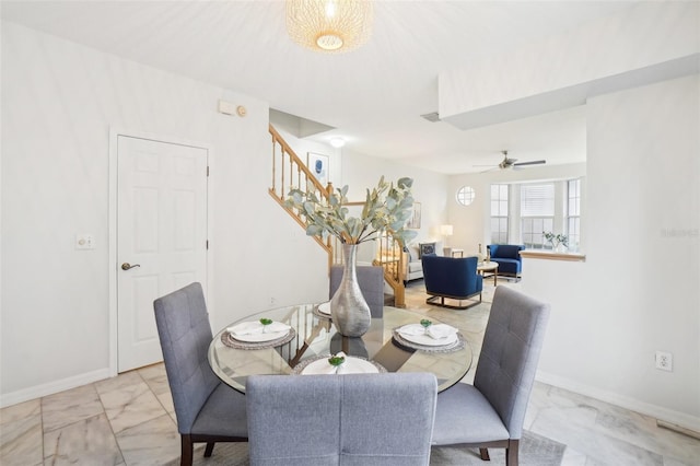 dining space with ceiling fan