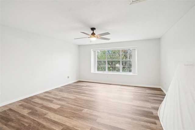 unfurnished room with light hardwood / wood-style flooring and ceiling fan