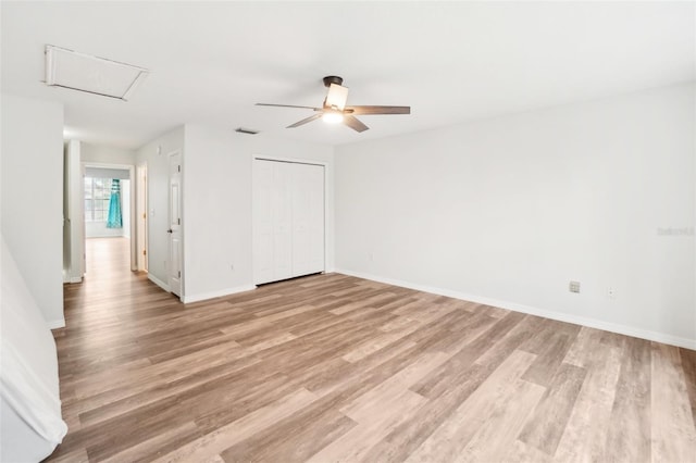 unfurnished room featuring ceiling fan and light wood-type flooring