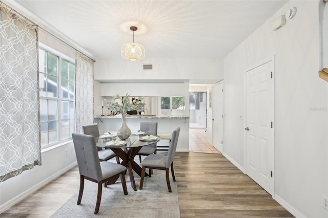2794 Countryside Blvd Unit 1, Clearwater, FL 33761 - dining space with plenty of natural light and wood finished floors
