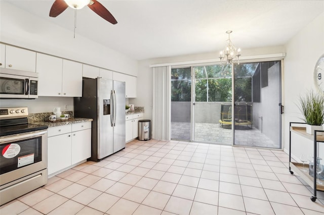 2794 Countryside Blvd Unit 1, Clearwater, FL 33761 - kitchen featuring stainless steel appliances, a chandelier, white cabinetry, and ceiling fan