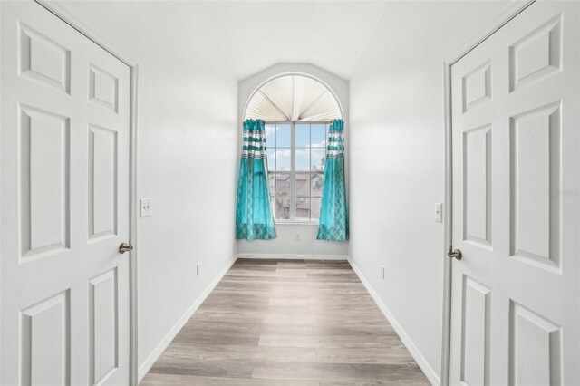 2794 Countryside Blvd Unit 1, Clearwater, FL 33761 - foyer with light wood finished floors and vaulted ceiling