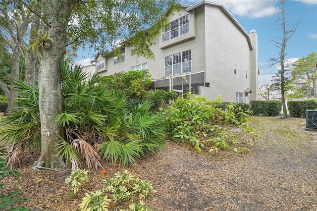 2794 Countryside Blvd Unit 1, Clearwater, FL 33761 - back of property featuring stucco siding and a chimney