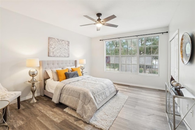 2794 Countryside Blvd Unit 1, Clearwater, FL 33761 - bedroom with wood finished floors and a ceiling fan