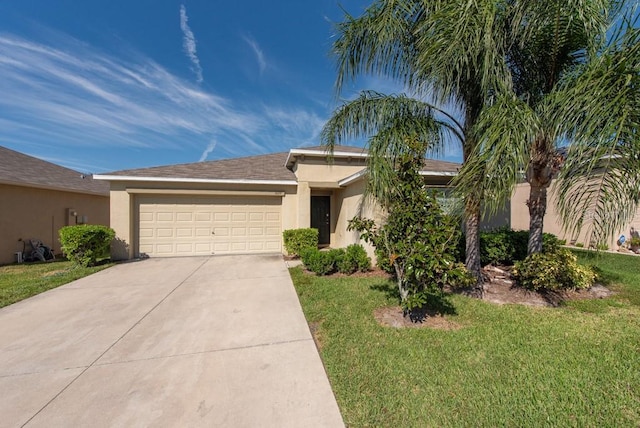 view of front of property featuring a garage and a front yard