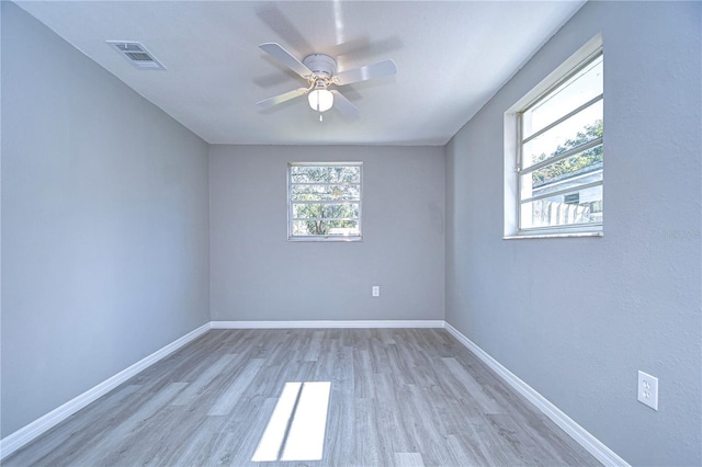 unfurnished room with ceiling fan and light hardwood / wood-style floors