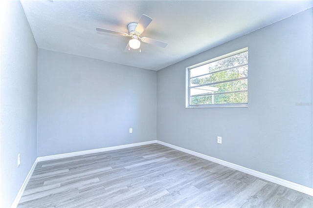 empty room featuring ceiling fan and wood-type flooring