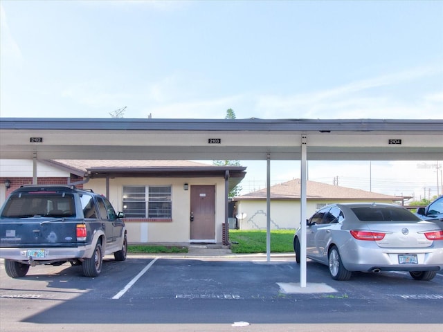 view of parking with a carport