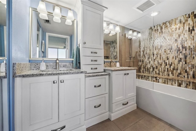 full bathroom with tile patterned flooring, a sink, and visible vents