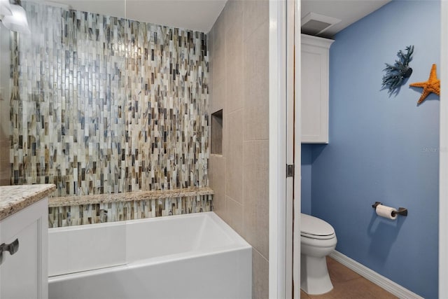 bathroom featuring a tub to relax in, toilet, vanity, baseboards, and a shower